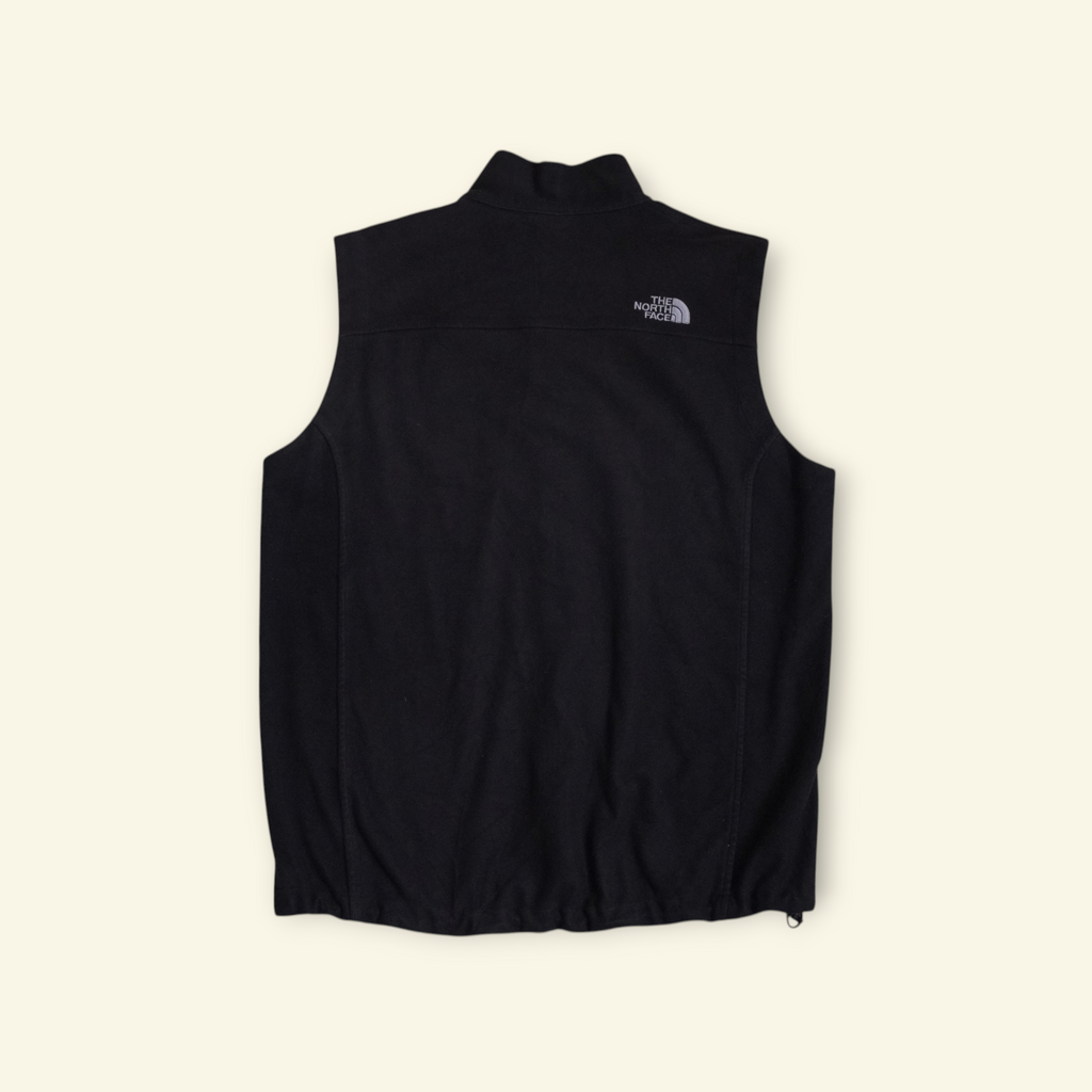 Vista trasera del chaleco negro The North Face Apex Bionic de Mi tienda, con tejido softshell y logo bordado.