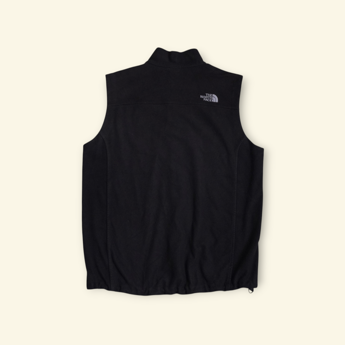 Vista trasera del chaleco negro The North Face Apex Bionic de Mi tienda, con tejido softshell y logo bordado.