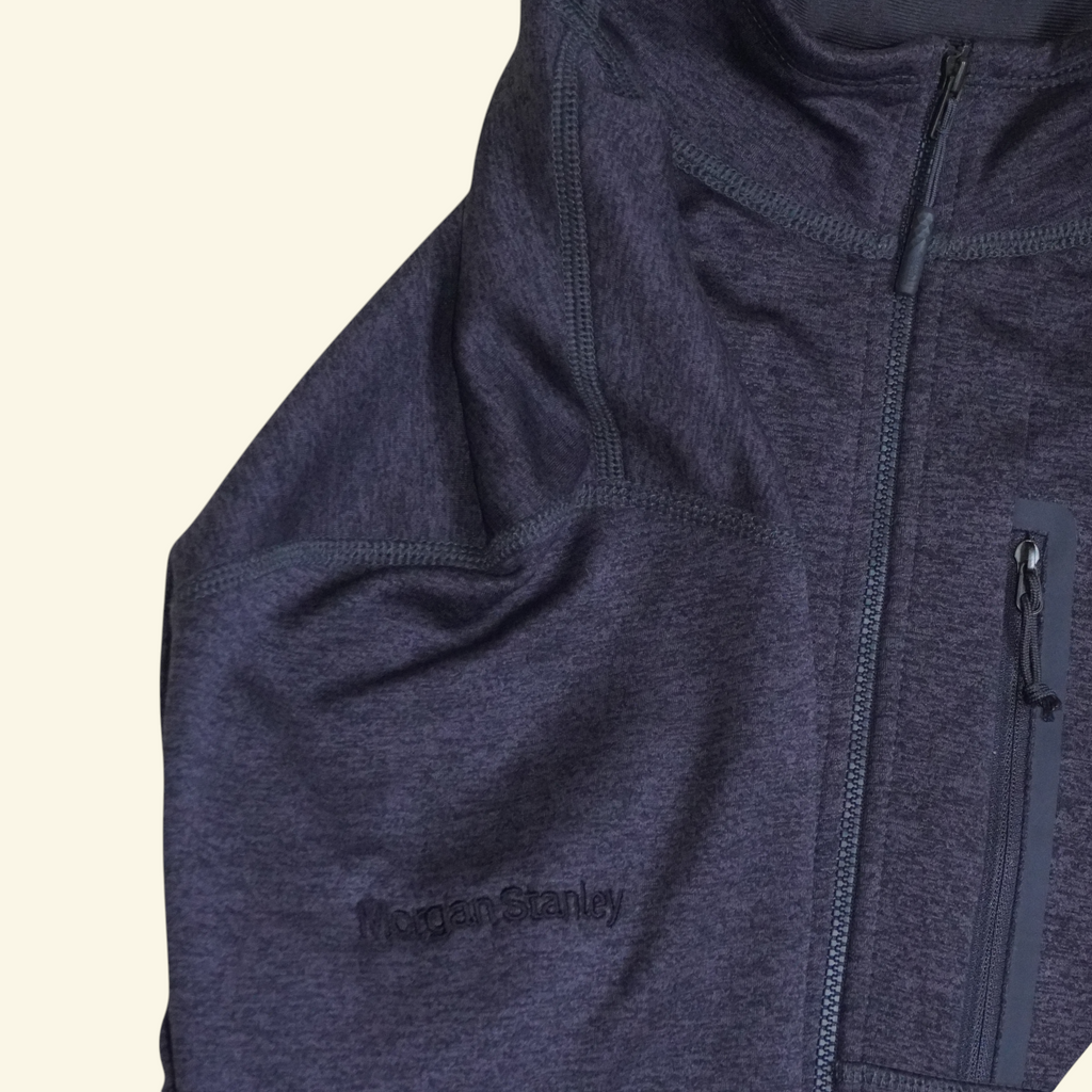 Chaqueta técnica negra The North Face con cierre completo, cuello alto y bordado corporativo Morgan Stanley