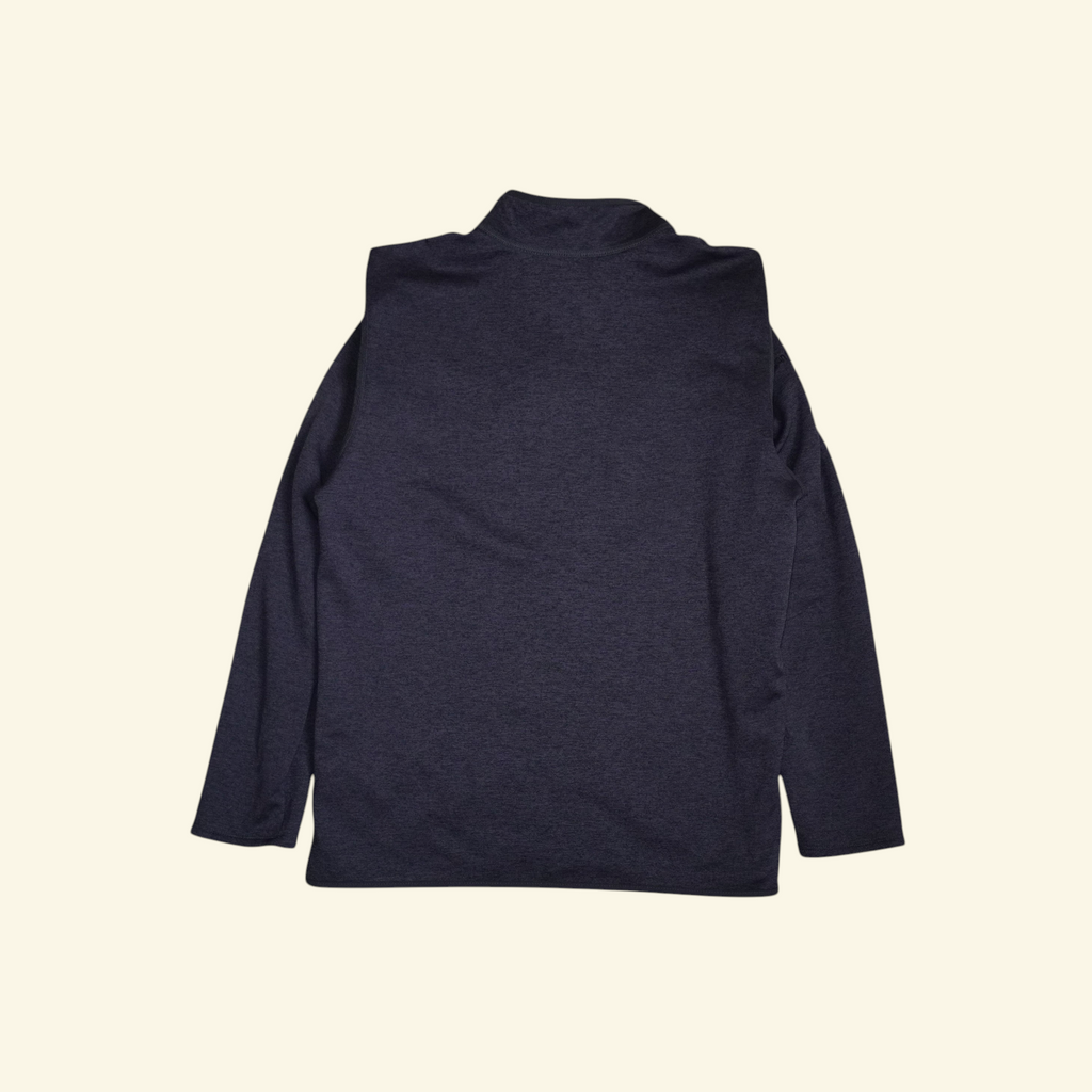Vista trasera de la chaqueta negra The North Face Skyline con cuello alto, tejido técnico suave y corte ejecutivo.